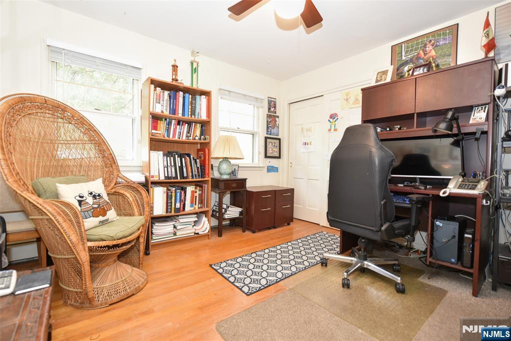 951 Berdan Avenue Wayne, NJ 07470 - Photo 20 of 39 a view of a workspace with furniture and a bookshelf