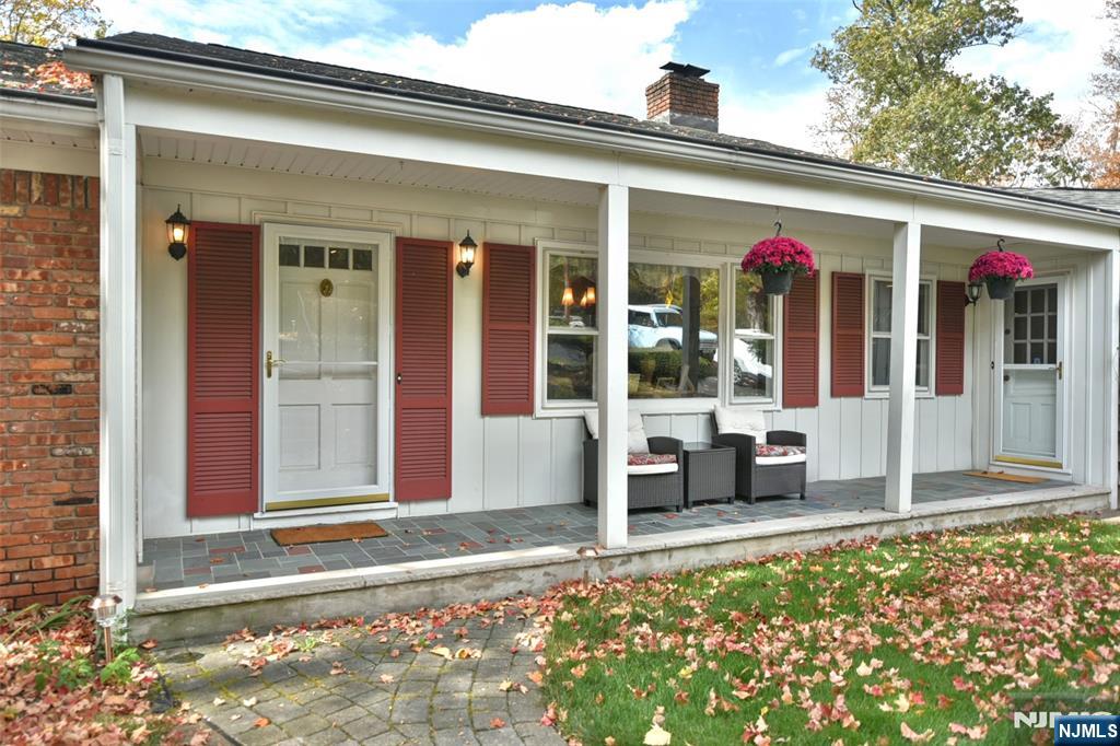 951 Berdan Avenue Wayne, NJ 07470 - Photo 2 of 39 a front view of a house with a porch
