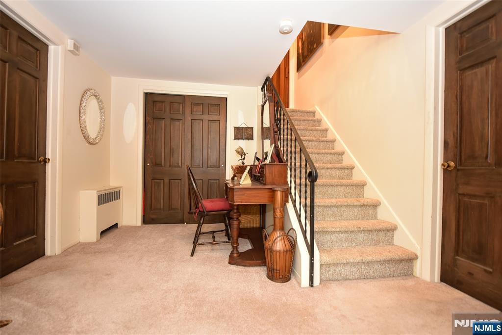 951 Berdan Avenue Wayne, NJ 07470 - Photo 21 of 39 a view of a livingroom with furniture and staircase
