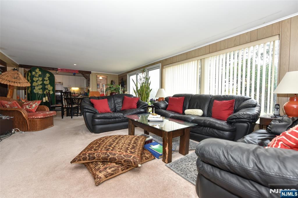 951 Berdan Avenue Wayne, NJ 07470 - Photo 24 of 39 a living room with furniture and a large window