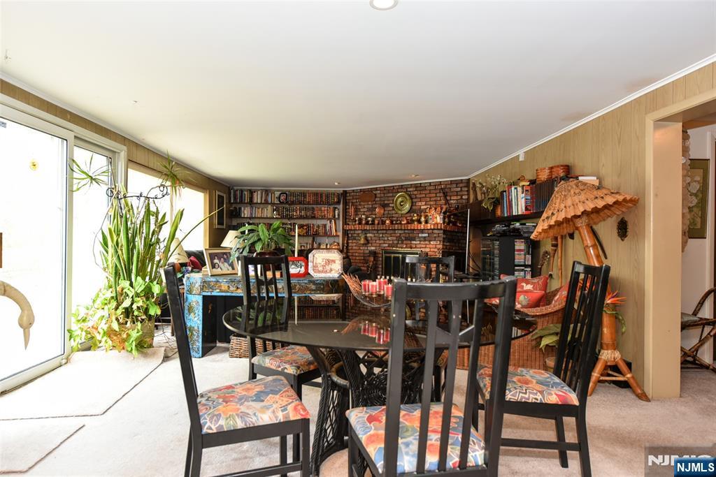 951 Berdan Avenue Wayne, NJ 07470 - Photo 26 of 39 a view of a dining room with furniture and chandelier