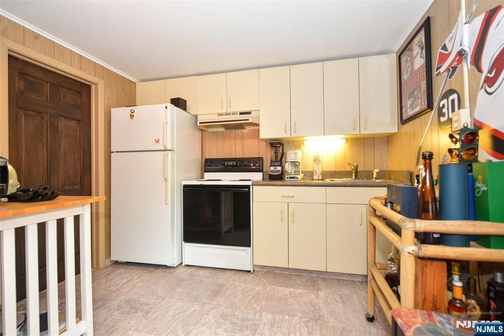 951 Berdan Avenue Wayne, NJ 07470 - Photo 28 of 39 a kitchen with a white cabinets and white appliances