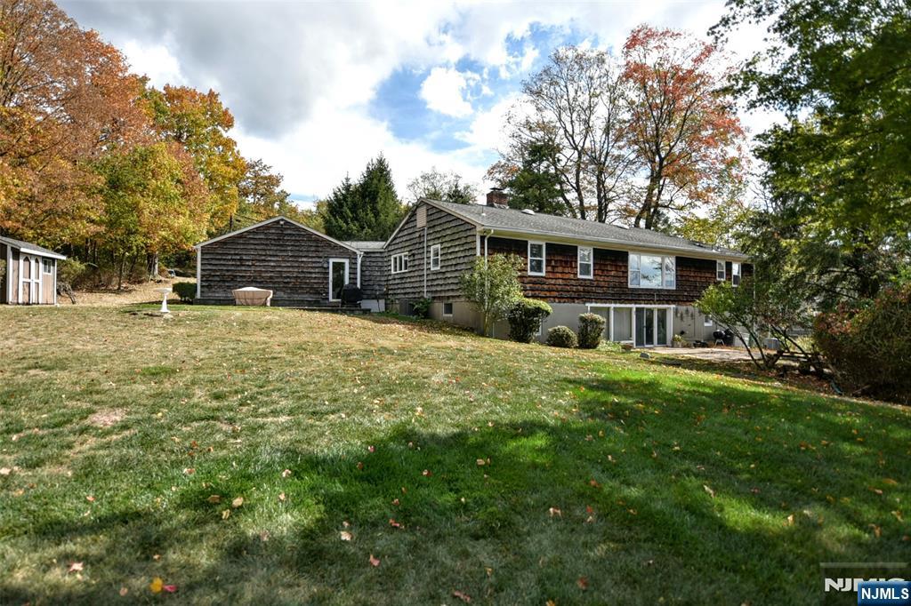 951 Berdan Avenue Wayne, NJ 07470 - Photo 30 of 39 a view of a house with a yard and potted plants