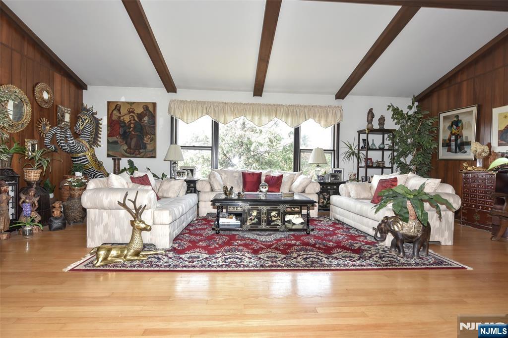 951 Berdan Avenue Wayne, NJ 07470 - Photo 6 of 39 a living room with furniture floor to ceiling window and a table