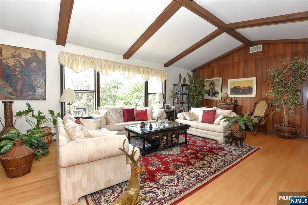 951 Berdan Avenue Wayne, NJ 07470 - Photo 8 of 39 a living room with furniture or couch and a large window