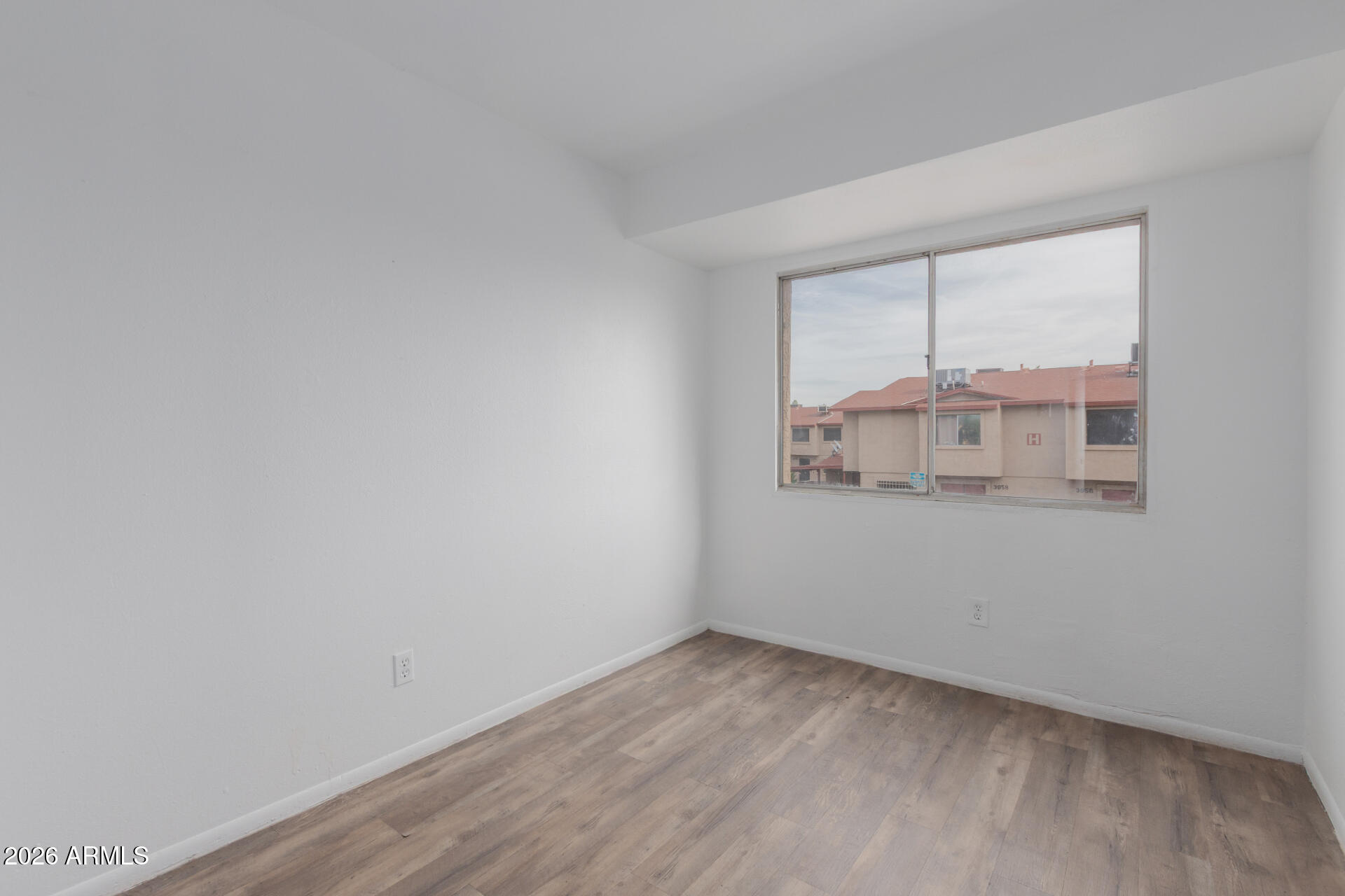 4002 West Palomino Road Phoenix, AZ 85019 - Photo 17 of 23 wooden floor in an empty room