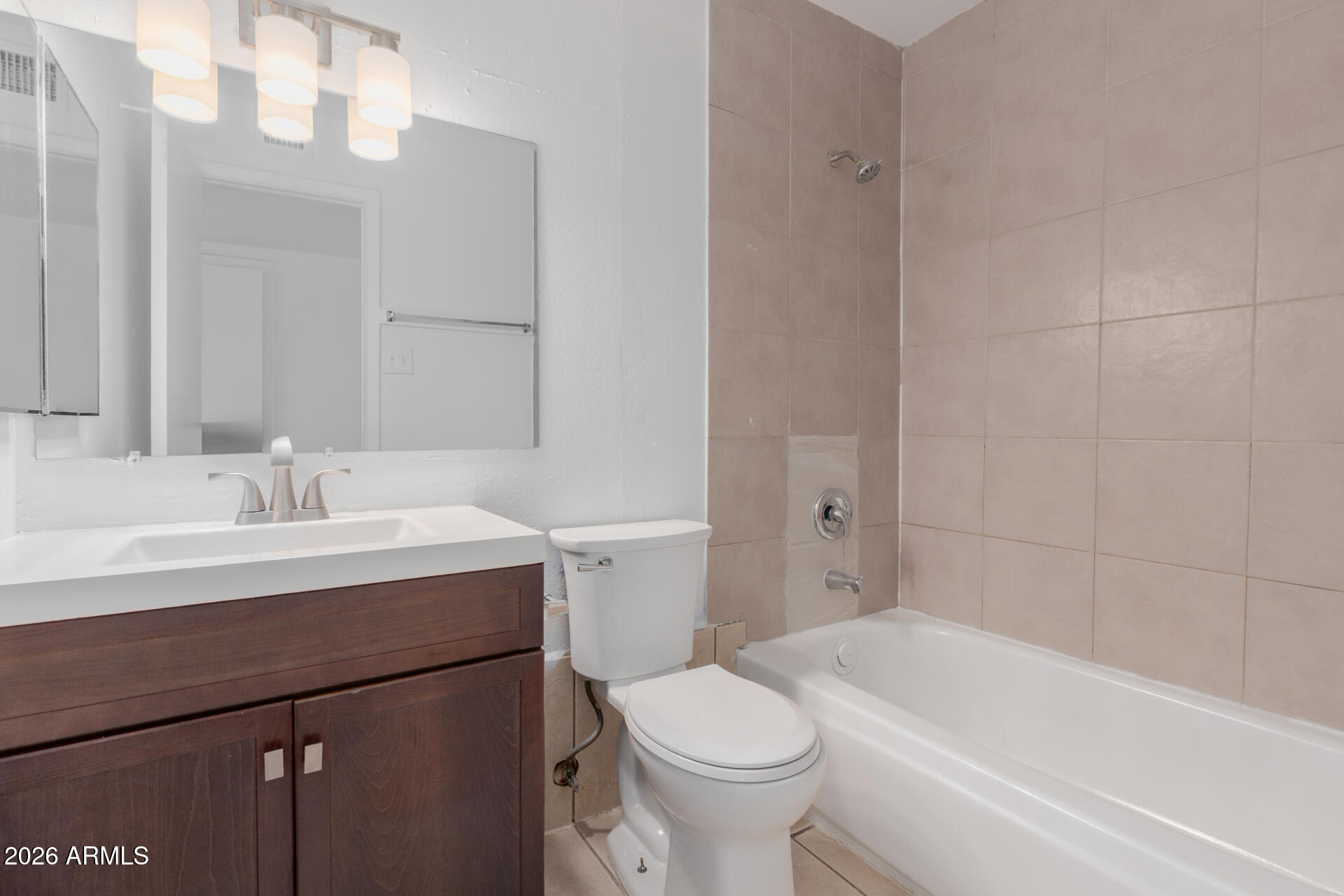 4002 West Palomino Road Phoenix, AZ 85019 - Photo 20 of 23 a bathroom with a sink toilet vanity and bathtub