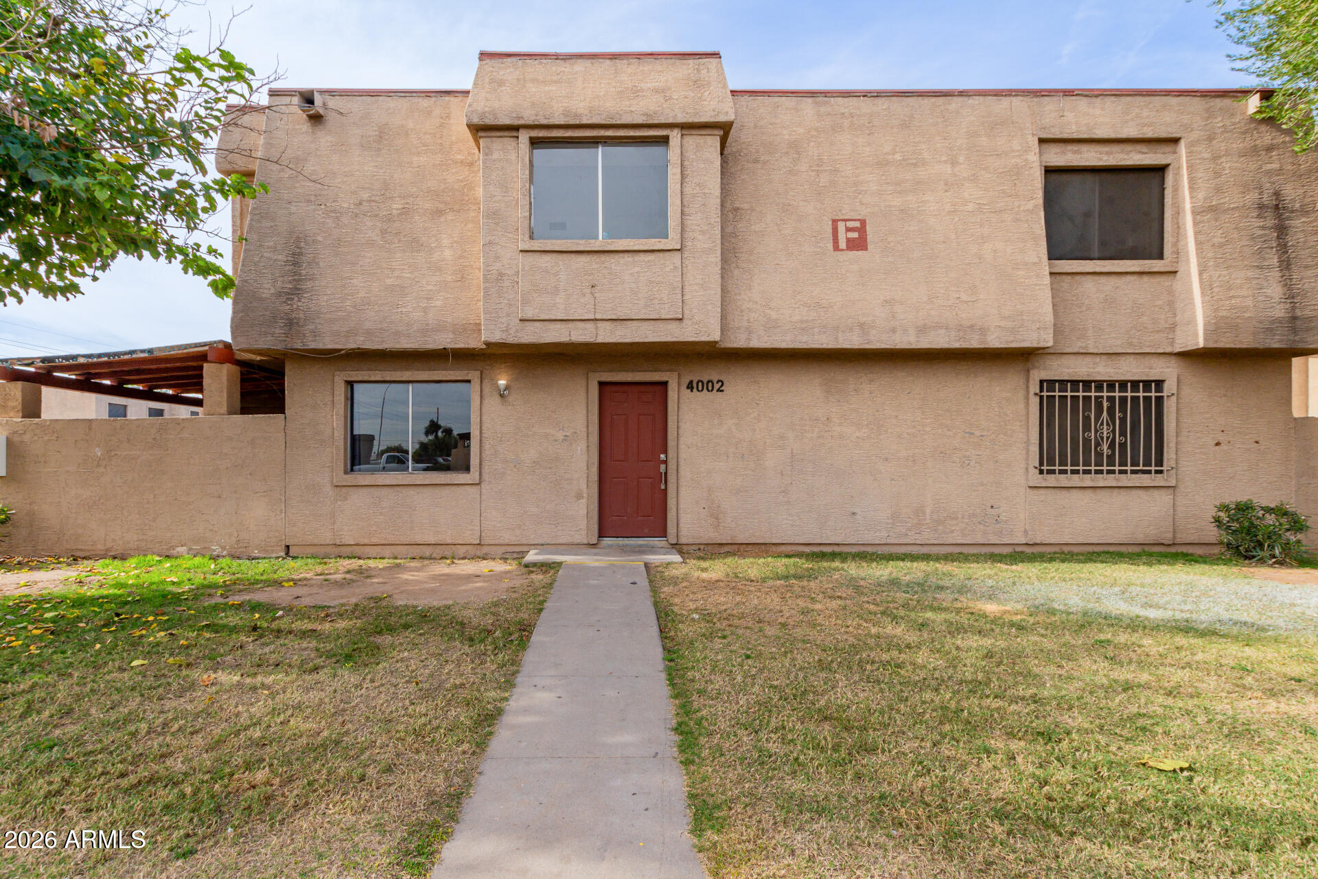 4002 West Palomino Road Phoenix, AZ 85019 - Photo 2 of 23 a view of a house with a backyard