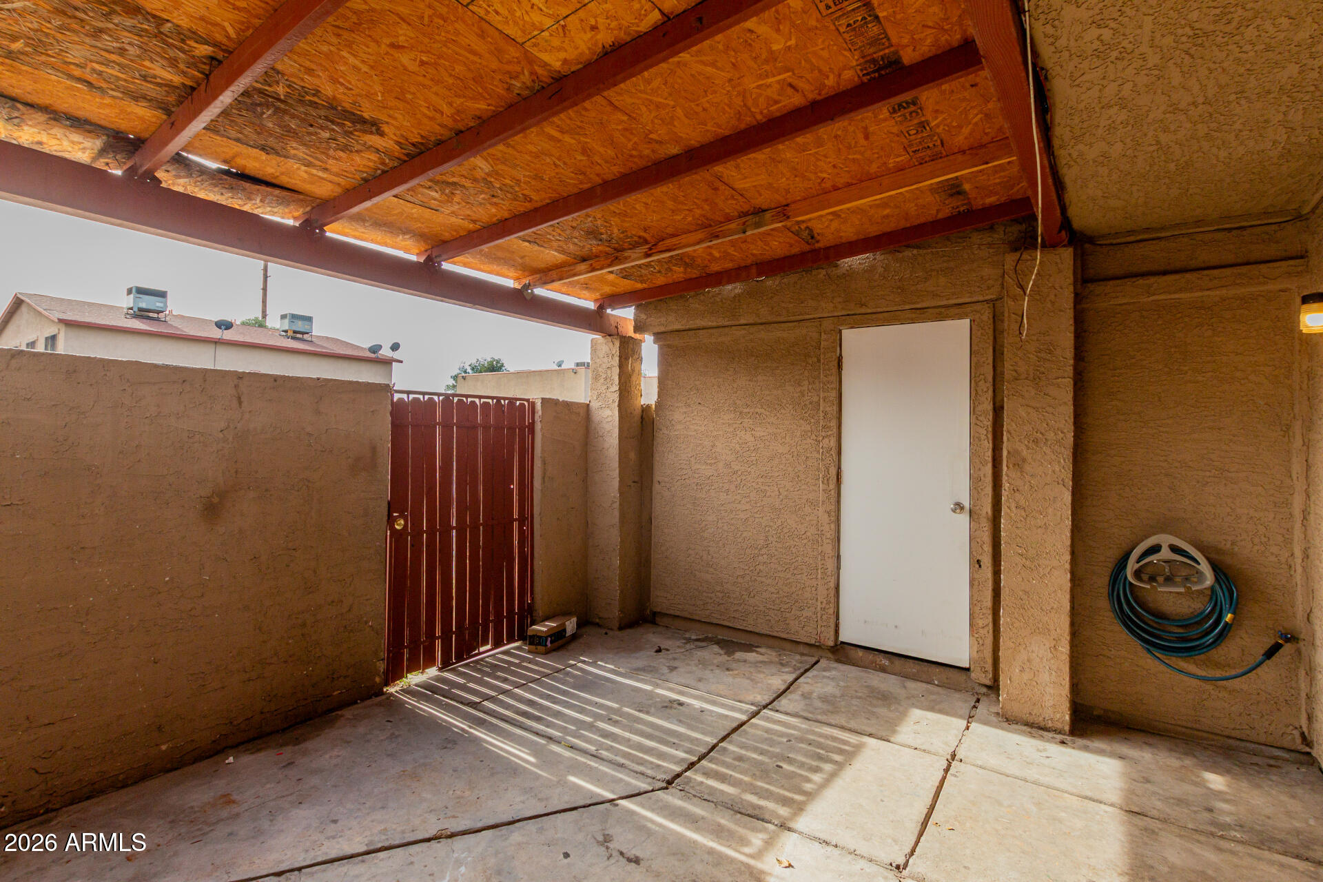 4002 West Palomino Road Phoenix, AZ 85019 - Photo 21 of 23 a view of a door with wooden walls