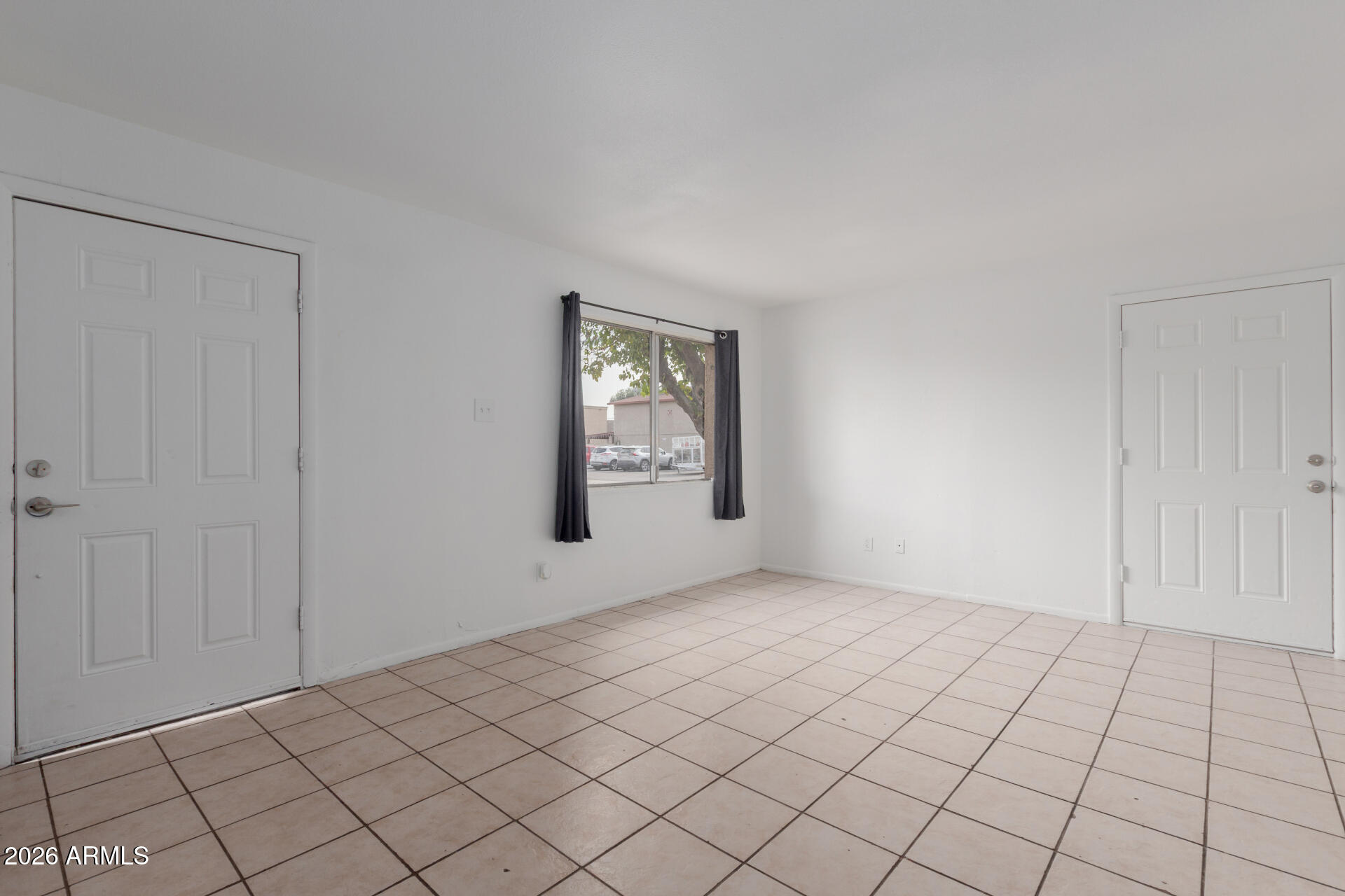 4002 West Palomino Road Phoenix, AZ 85019 - Photo 5 of 23 a view of an empty room and window