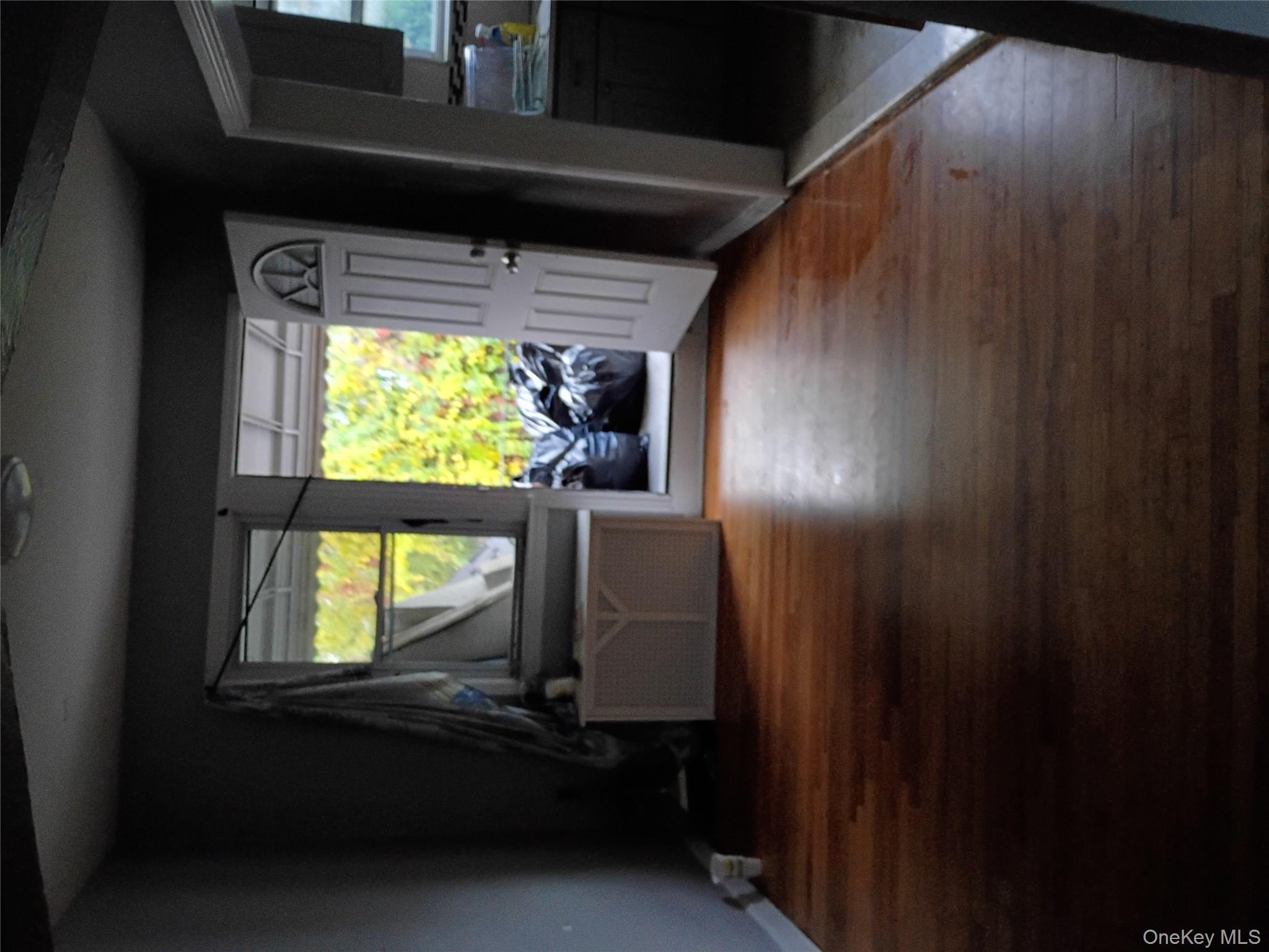 115-40 227th Street Queens, NY 11411 - Photo 5 of 9 a living room with furniture and a flat screen tv