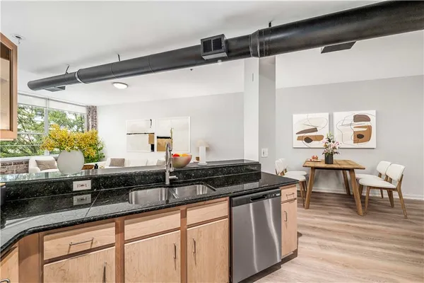 a kitchen that has a sink and a stove