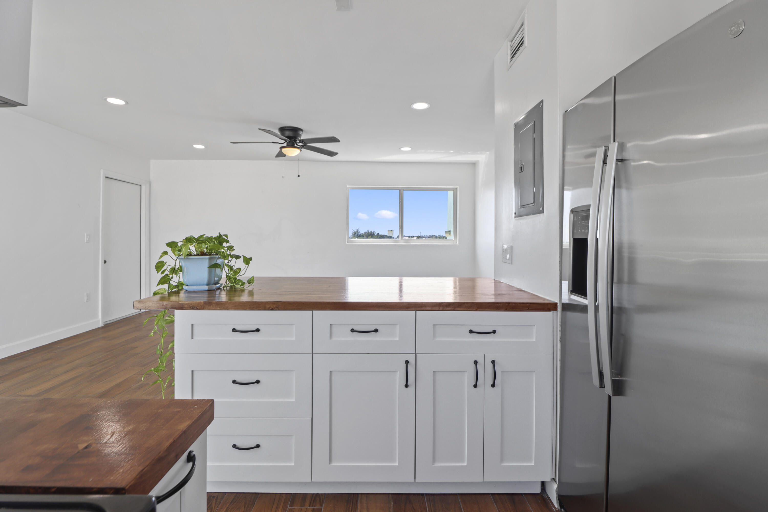 201 Coppitt Road, Unit 301A Key West, FL 33040 - Photo 11 of 25 a view of cabinets with wooden floor and cabinet