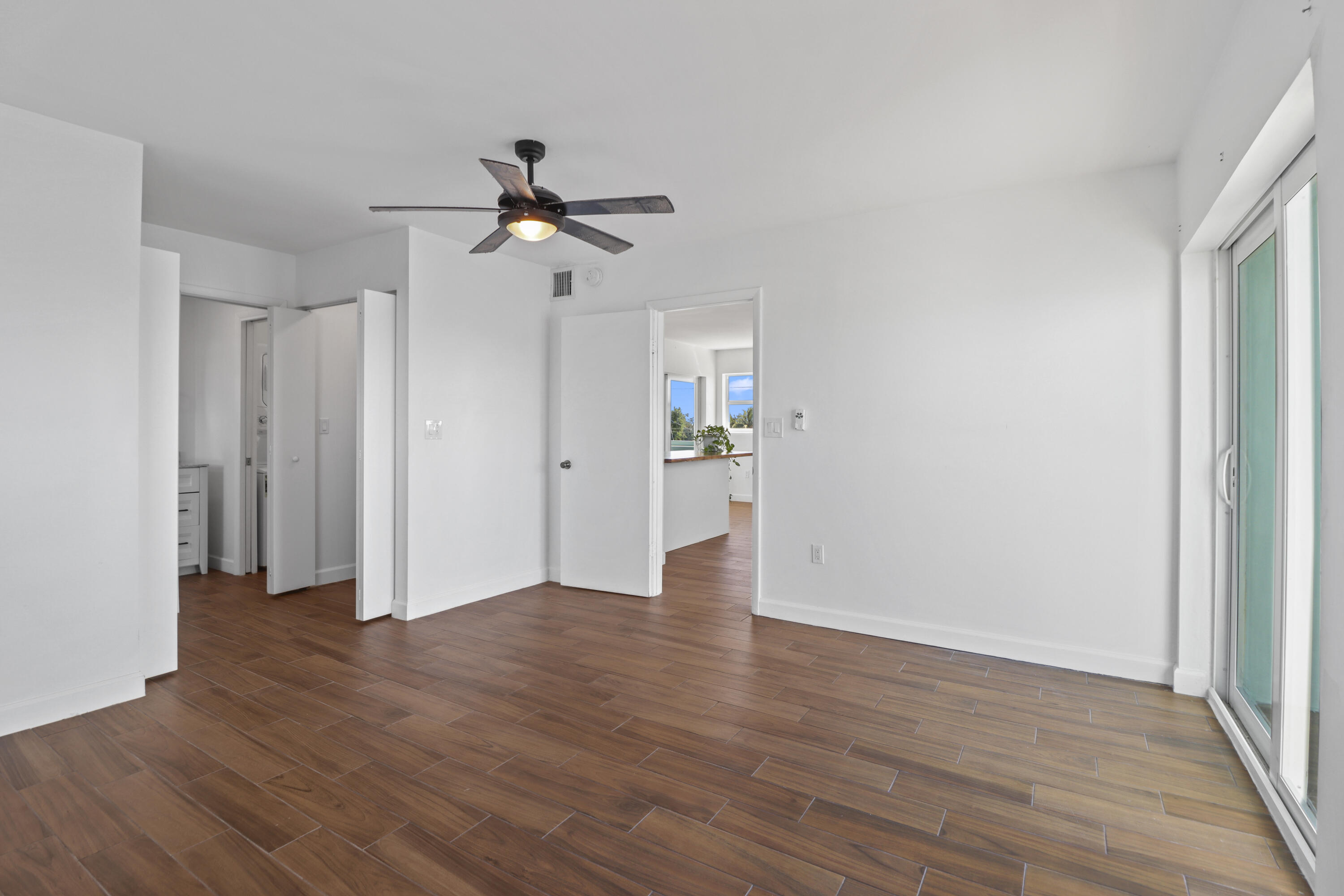 201 Coppitt Road, Unit 301A Key West, FL 33040 - Photo 14 of 25 a view of empty room with wooden floor