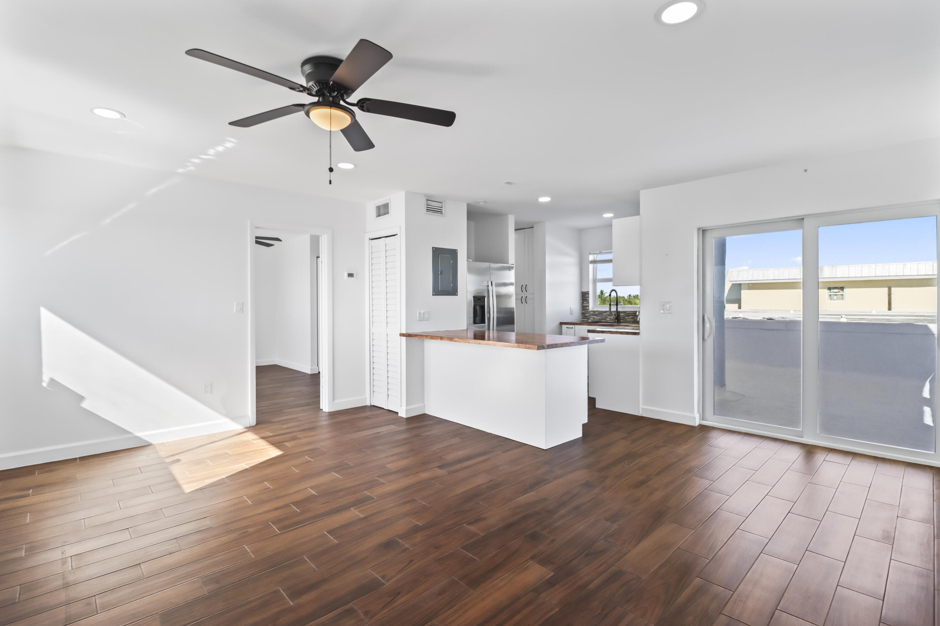 201 Coppitt Road, Unit 301A Key West, FL 33040 - Photo 4 of 25 a view of kitchen with cabinets and wooden floor