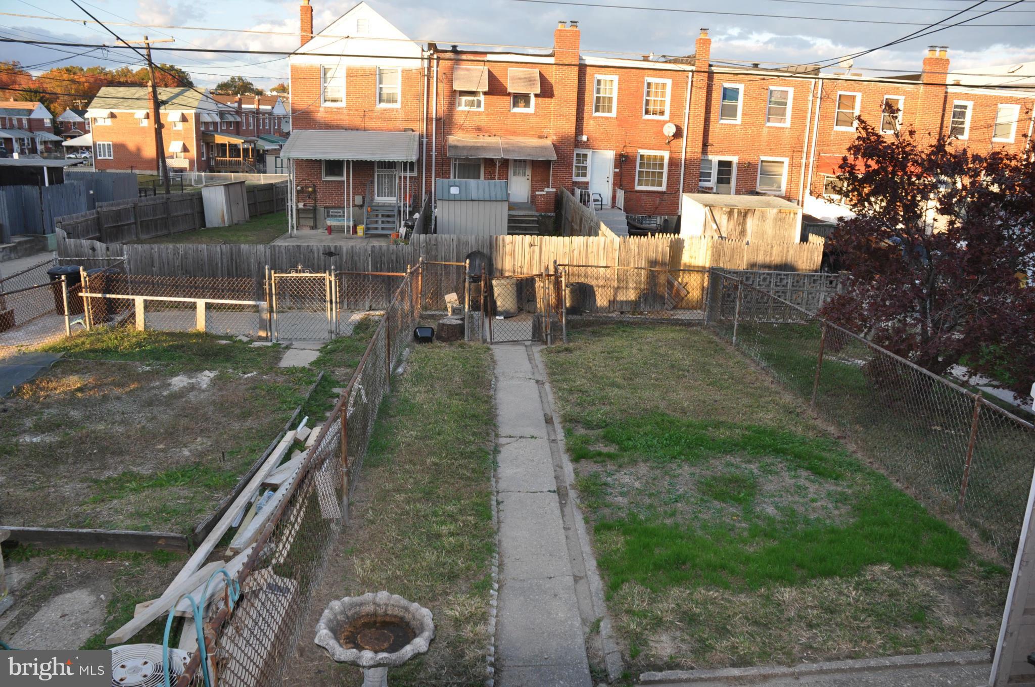 7438 Edsworth Road Baltimore, MD 21222 - Photo 12 of 12 a view of a porch with a yard