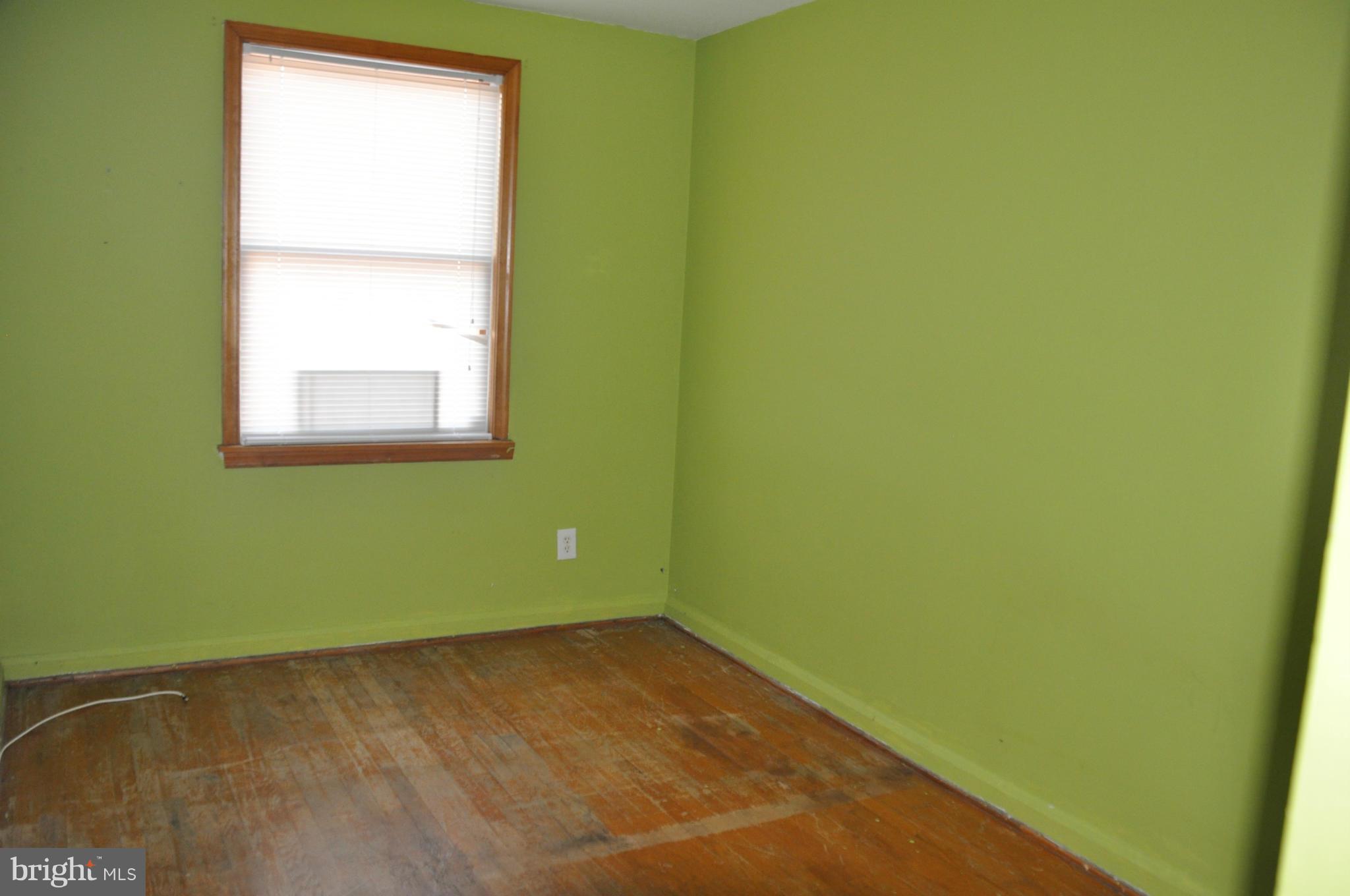 7438 Edsworth Road Baltimore, MD 21222 - Photo 9 of 12 a view of a room with a window