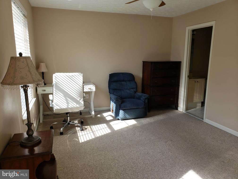 7151 Natures Road Columbia, MD 21046 - Photo 11 of 33 a living room with furniture and a lamp