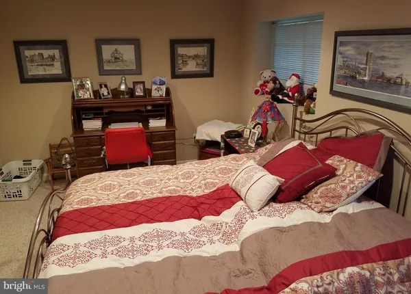 a bedroom with a bed and furniture