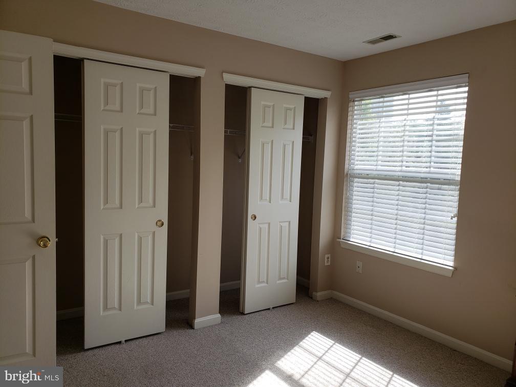 7151 Natures Road Columbia, MD 21046 - Photo 22 of 33 a view of an empty room with window