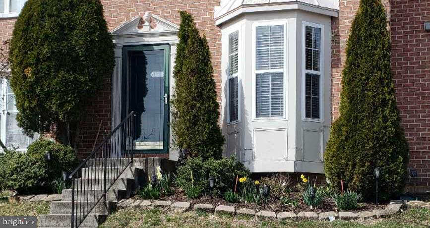 7151 Natures Road Columbia, MD 21046 - Photo 3 of 33 a front view of a house with garden