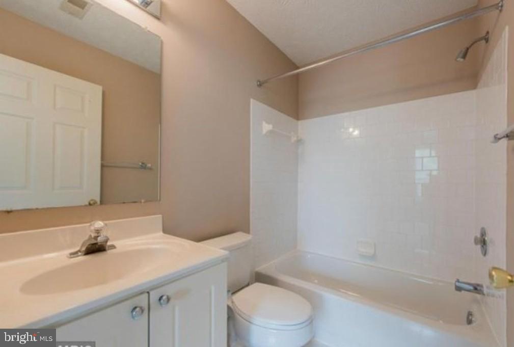 7151 Natures Road Columbia, MD 21046 - Photo 31 of 33 a bathroom with a sink a toilet and shower