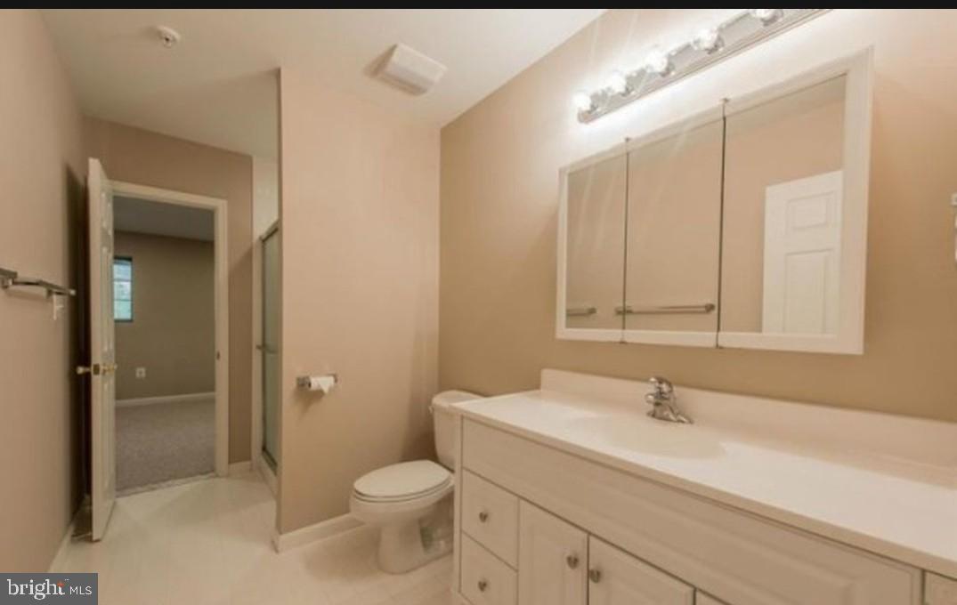 7151 Natures Road Columbia, MD 21046 - Photo 32 of 33 a bathroom with a sink a toilet and shower