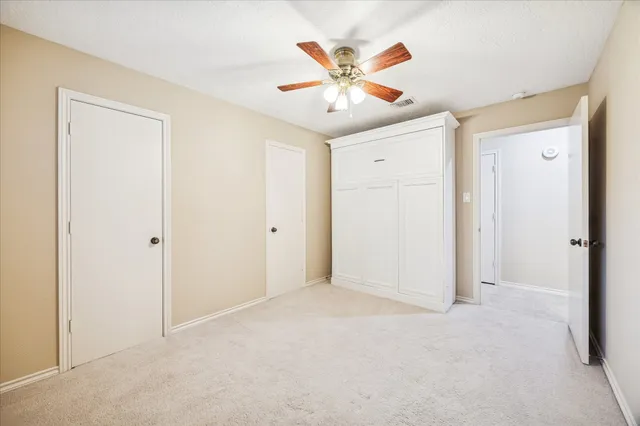 a spacious bathroom with a double vanity sink a mirror and a bathtub