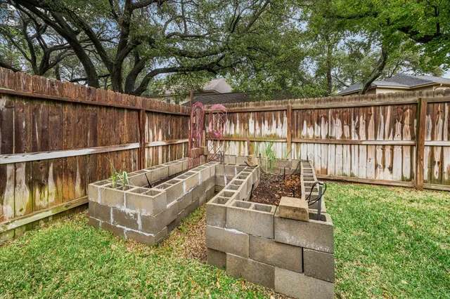a sign that is in front of flowers