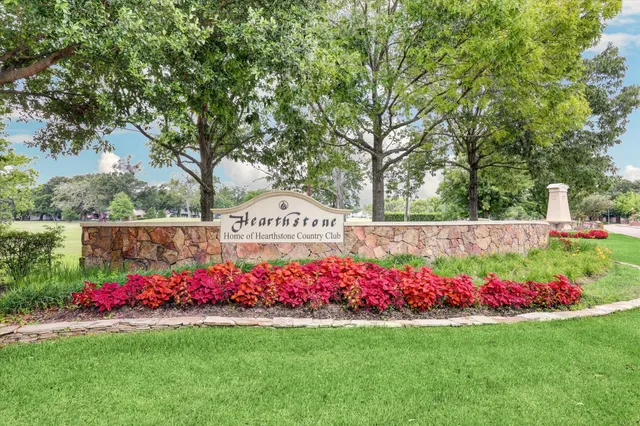 a view of a park with bench and trees