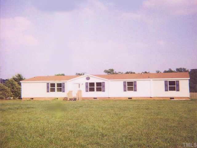 1390 Pixley Pritchard Road Timberlake, NC 27583 - Photo 1 of 1 a front view of residential houses with yard