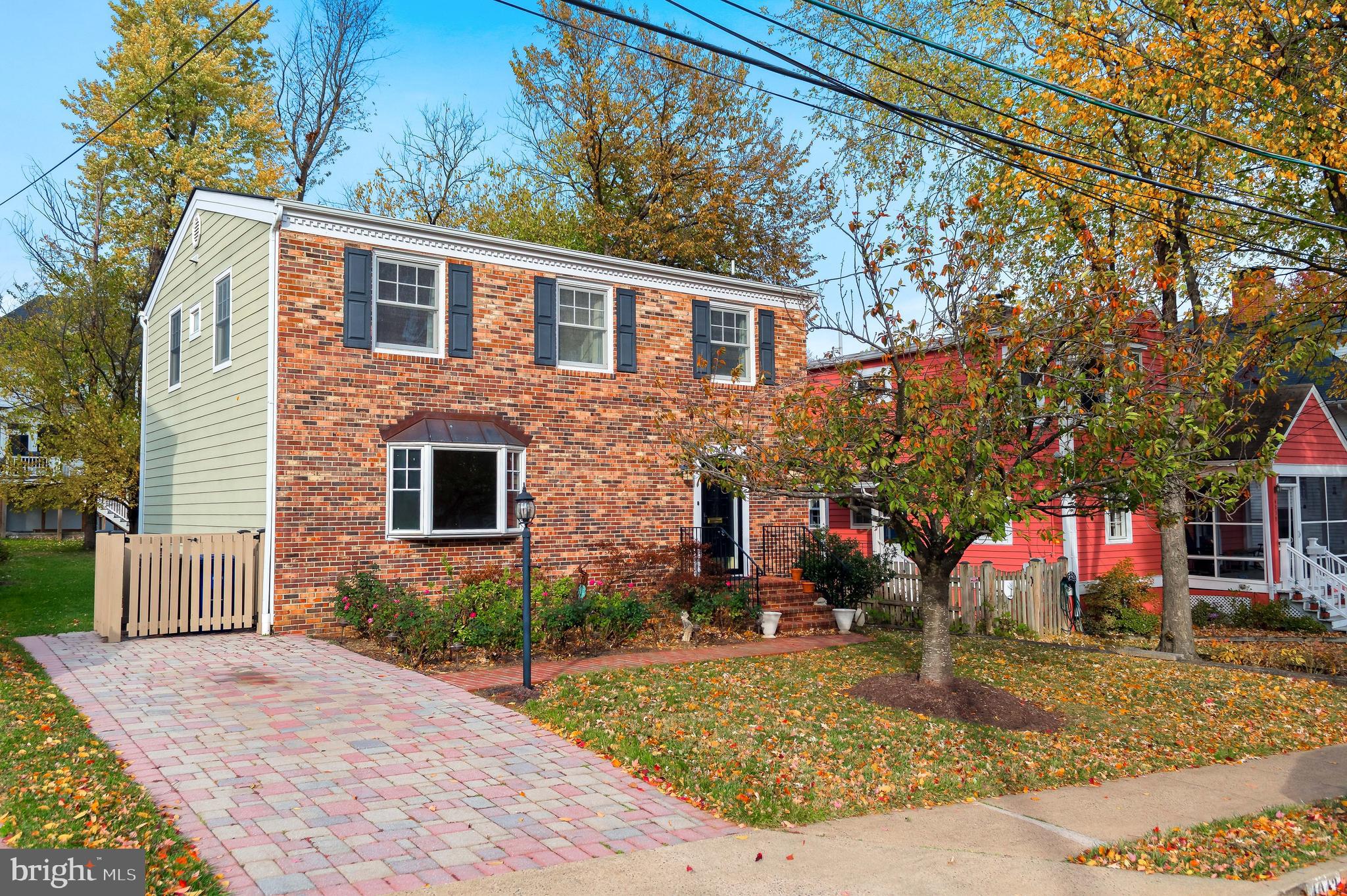 4043 20th Road North Arlington, VA 22207 - Photo 1 of 56 a front view of a house with garden
