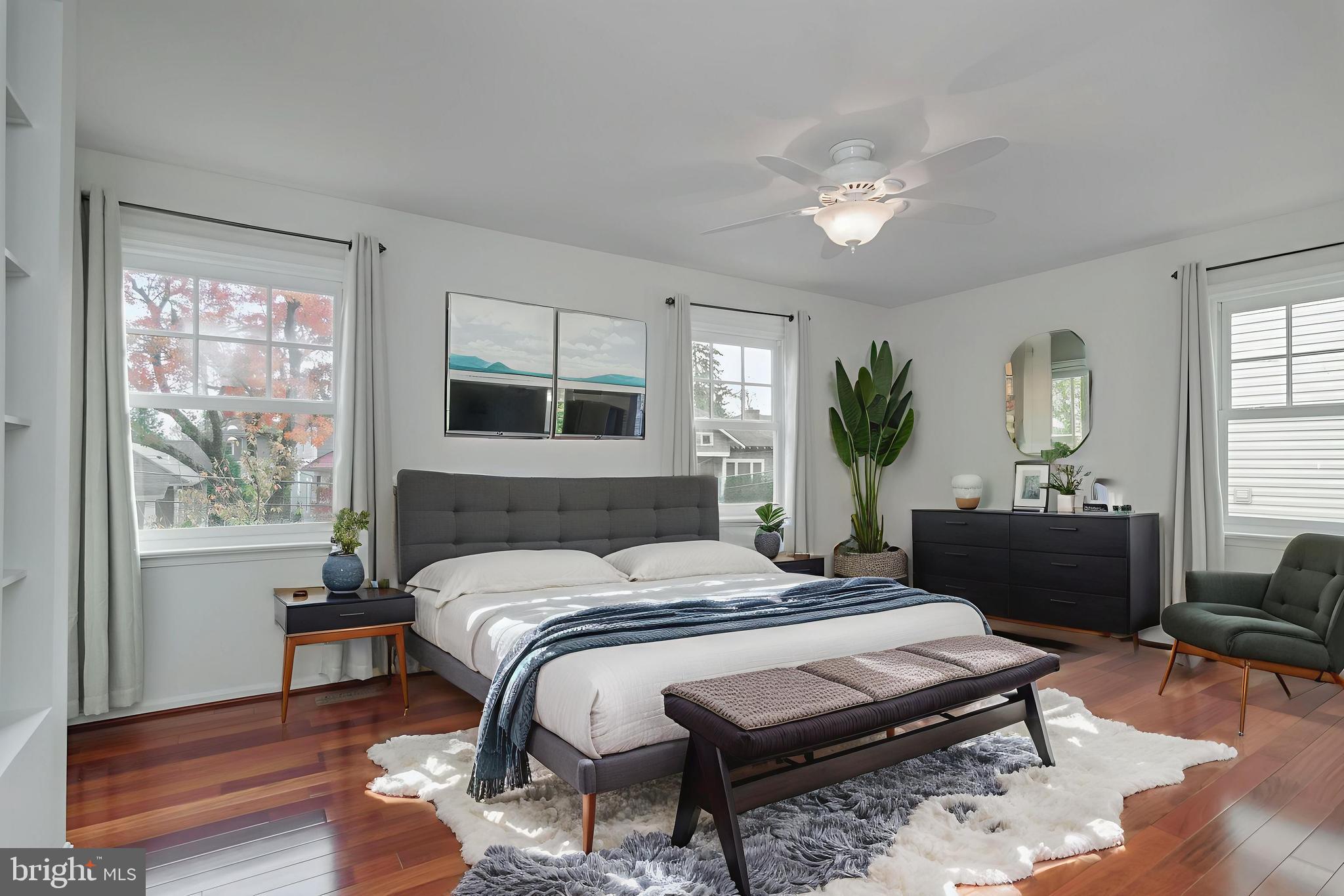 4043 20th Road North Arlington, VA 22207 - Photo 27 of 56 a bedroom with a bed a chandelier and a dresser