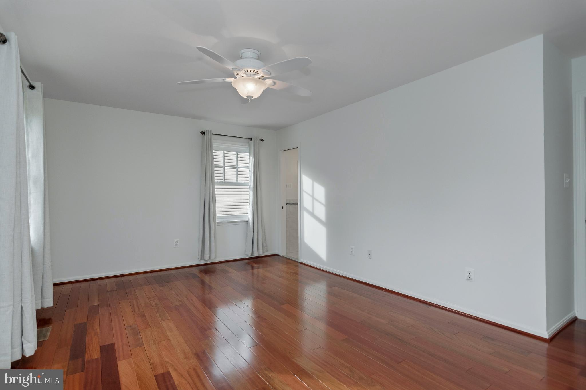 4043 20th Road North Arlington, VA 22207 - Photo 28 of 56 a view of an empty room with wooden floor and a window