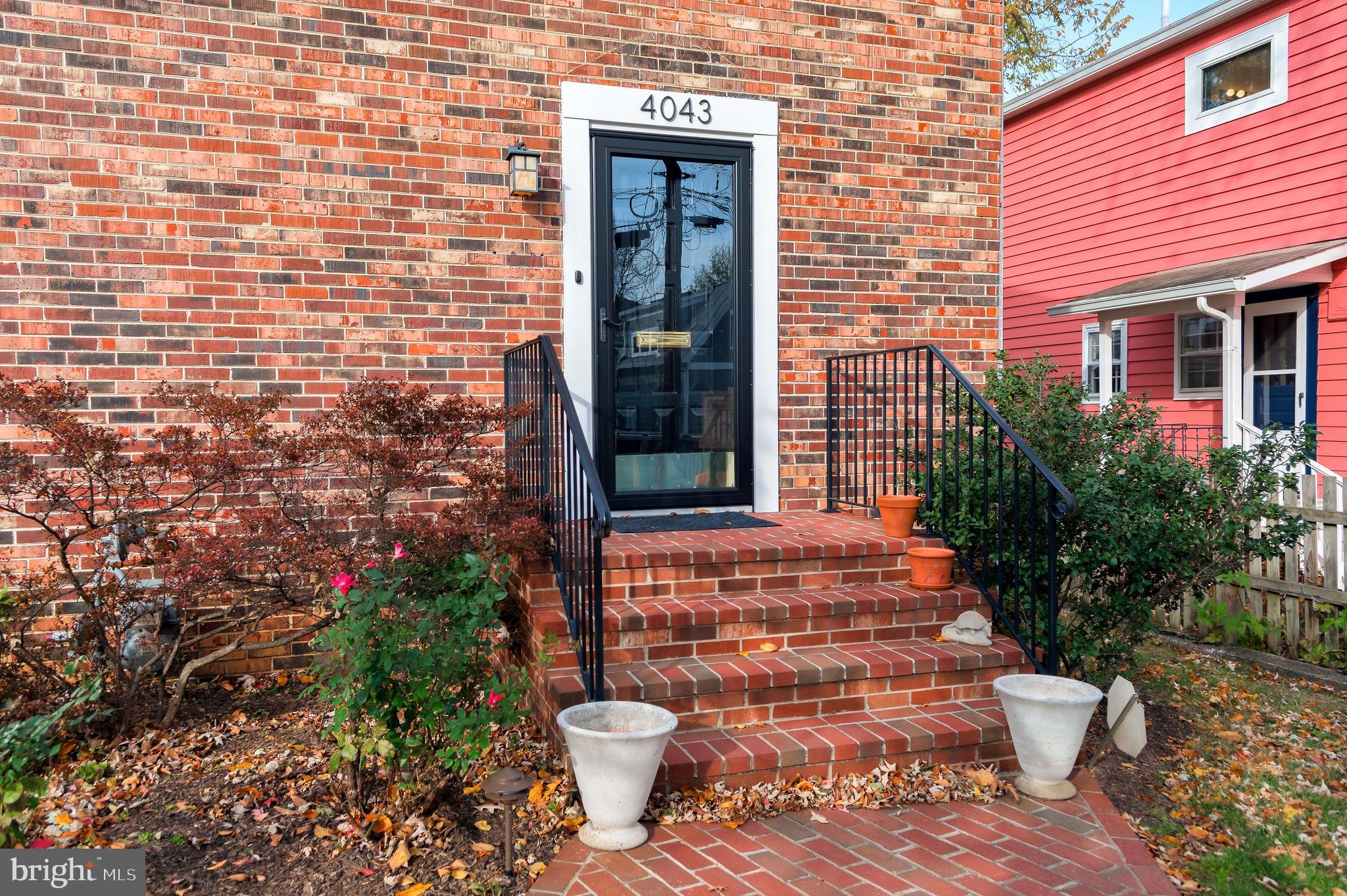 4043 20th Road North Arlington, VA 22207 - Photo 3 of 56 a view of a brick house with potted plants