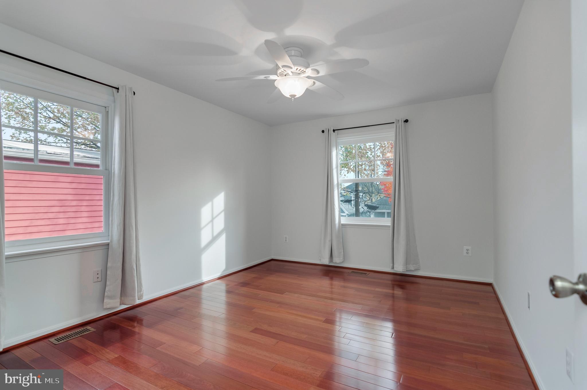 4043 20th Road North Arlington, VA 22207 - Photo 32 of 56 a view of an empty room with wooden floor and a window