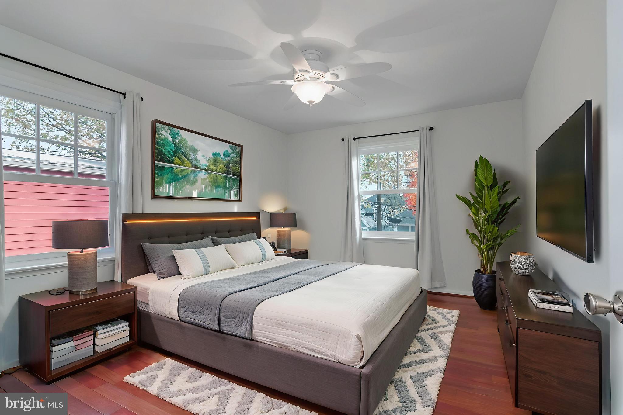 4043 20th Road North Arlington, VA 22207 - Photo 33 of 56 a bedroom with a large bed and a flat tv screen on dresser