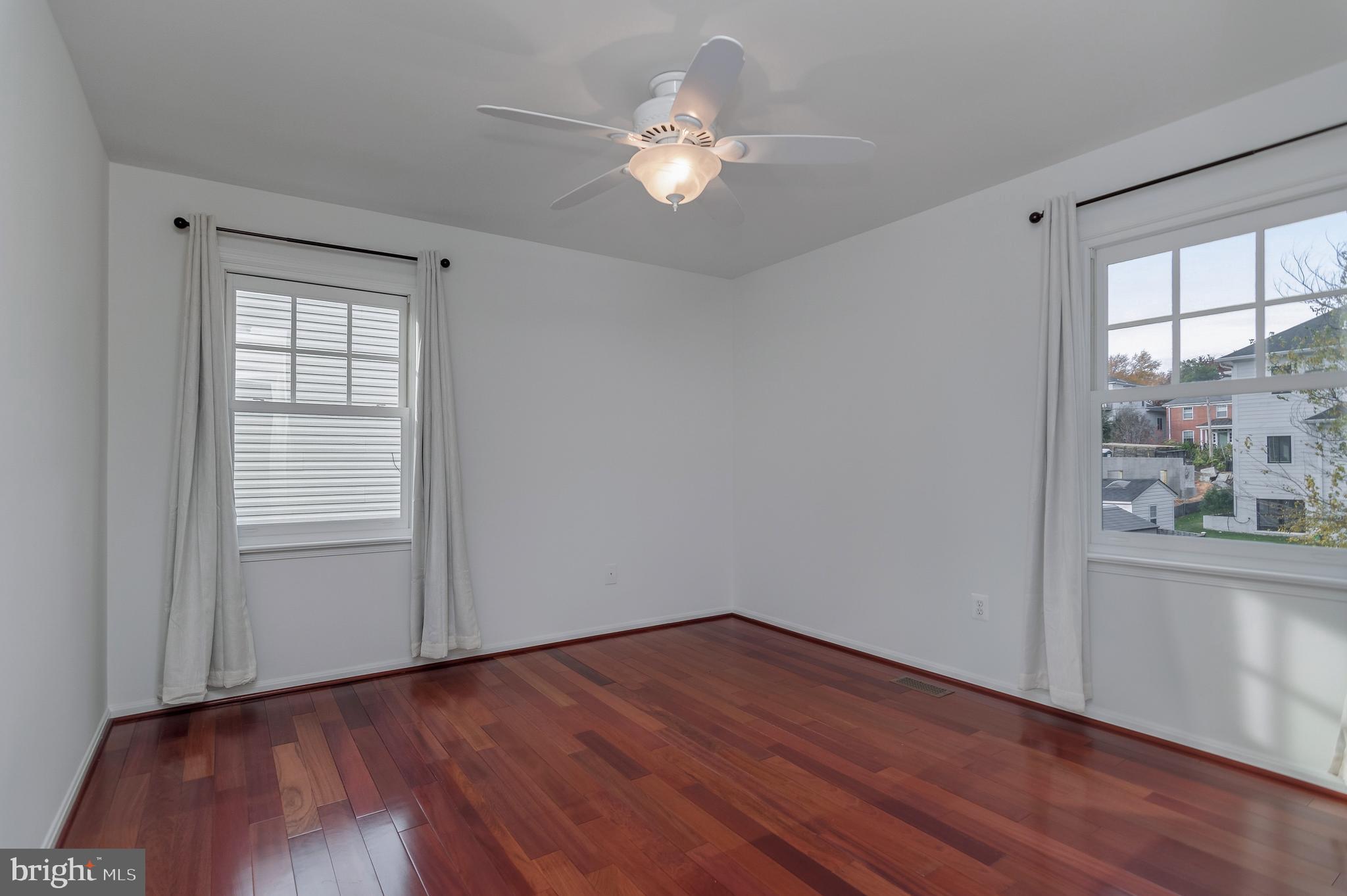 4043 20th Road North Arlington, VA 22207 - Photo 35 of 56 a view of an empty room with wooden floor and a window