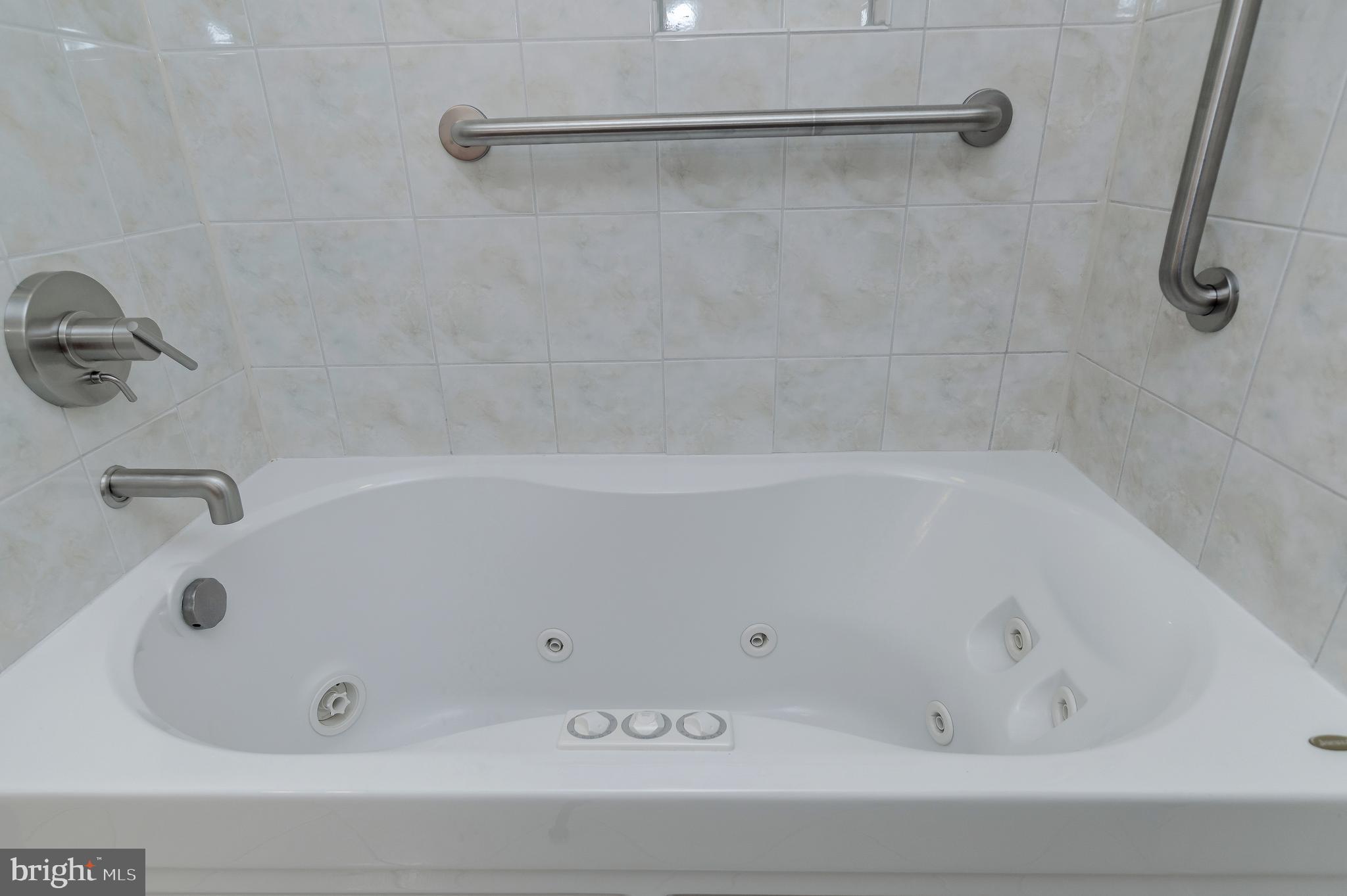 4043 20th Road North Arlington, VA 22207 - Photo 40 of 56 a bathroom with a tub and a shower