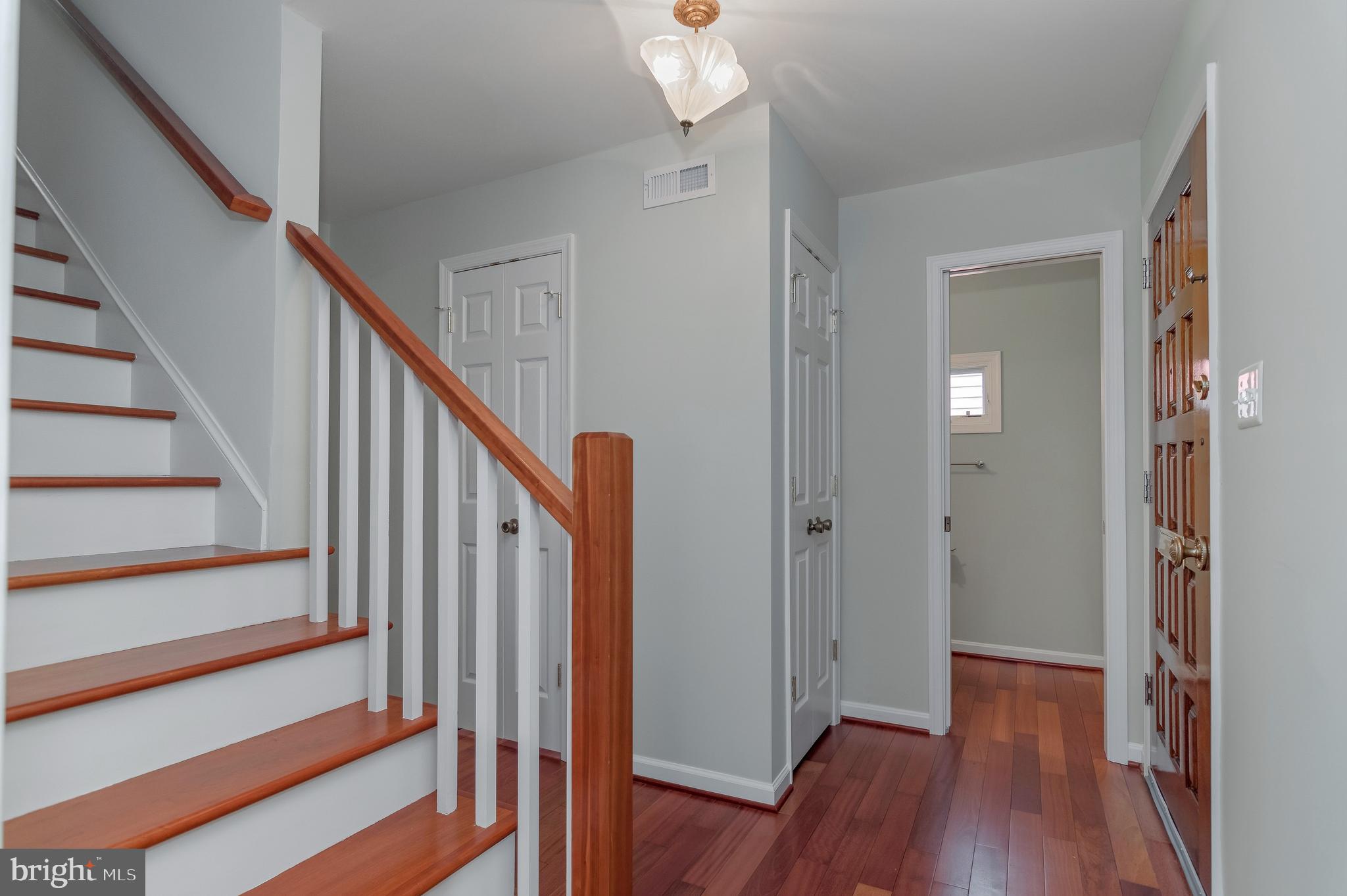 4043 20th Road North Arlington, VA 22207 - Photo 4 of 56 a view of a hallway with wooden floor and staircase