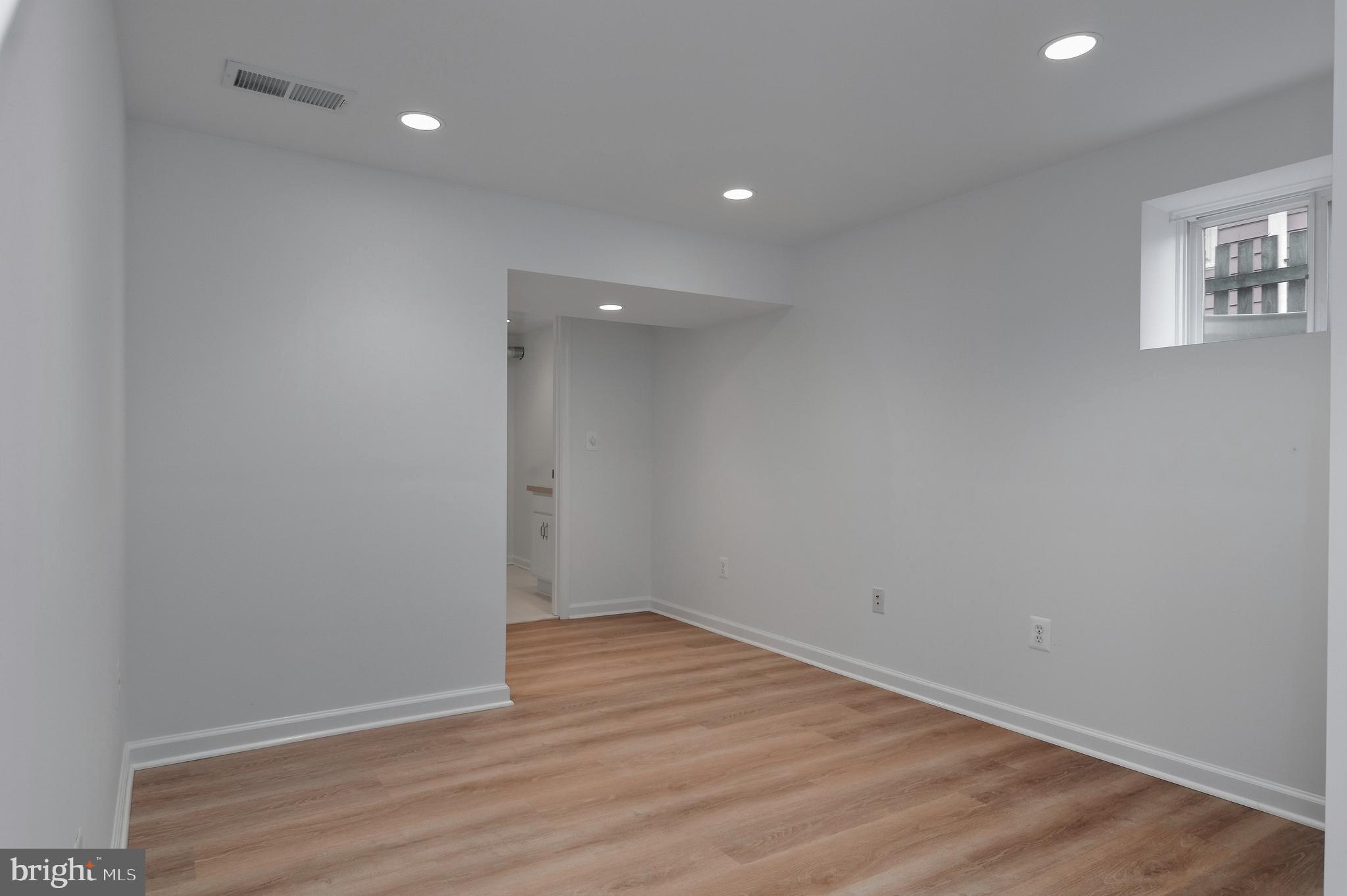 4043 20th Road North Arlington, VA 22207 - Photo 43 of 56 a view of an empty room with wooden floor and a window