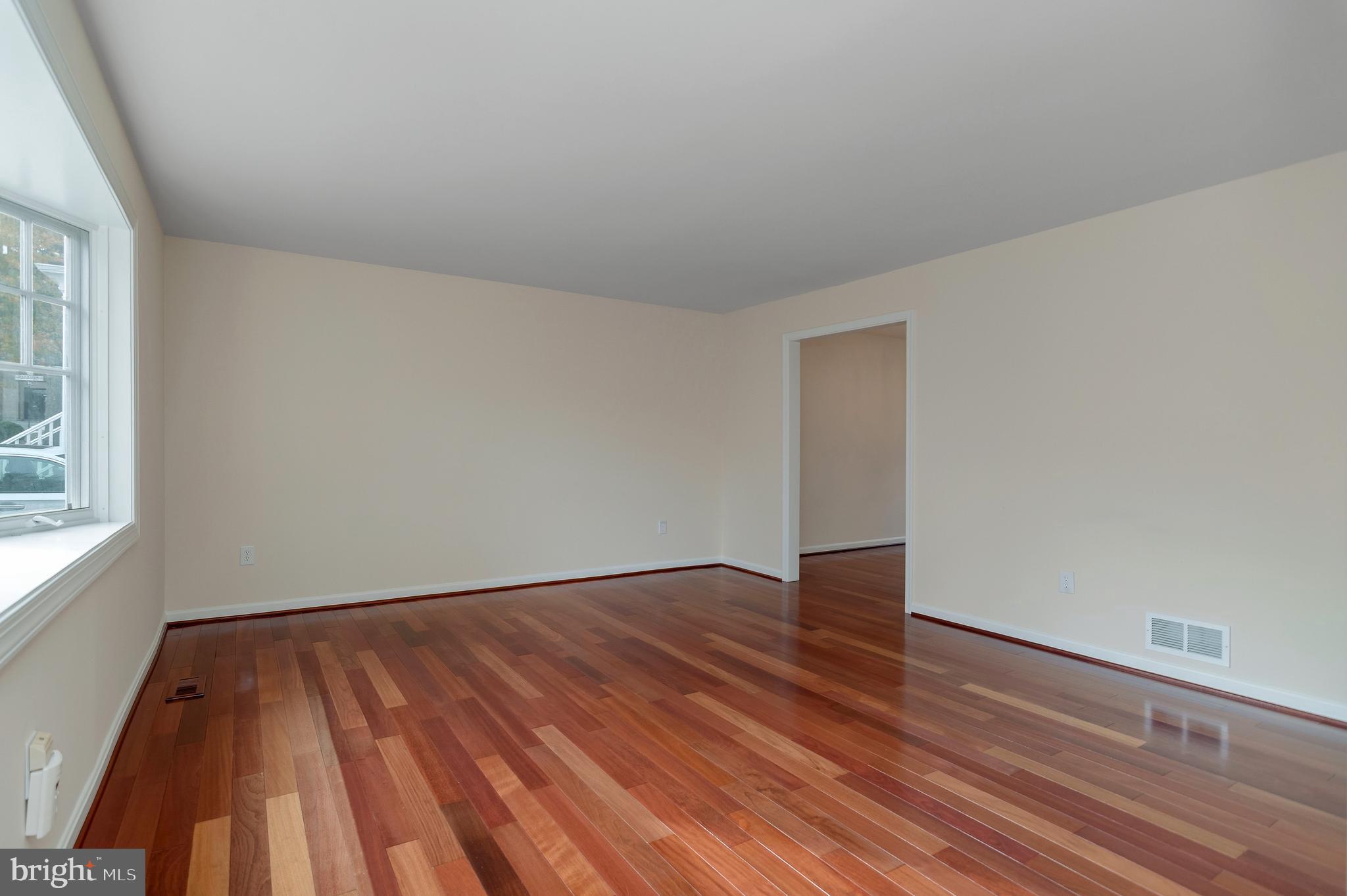 4043 20th Road North Arlington, VA 22207 - Photo 9 of 56 a view of an empty room with wooden floor and a window