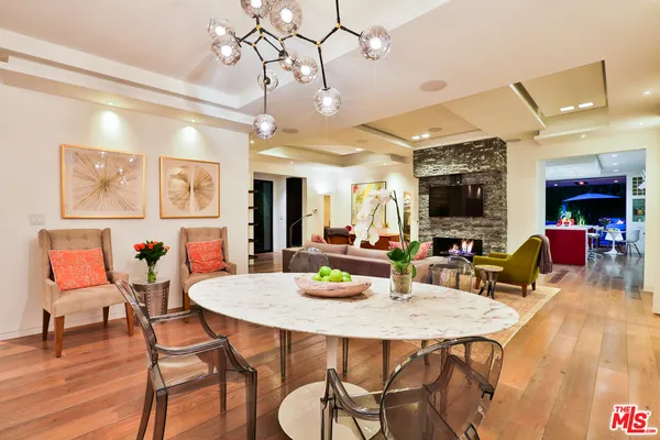 a living room with fireplace furniture and a fireplace