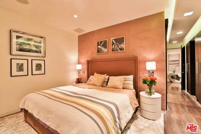 a bathroom with a double vanity sink toilet and shower