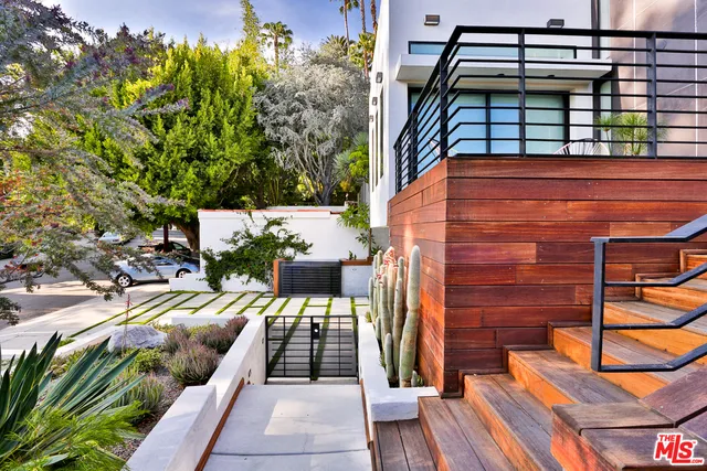 a view of a backyard with a patio and plants