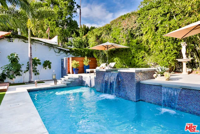 a view of a chairs and table in patio with wooden floor