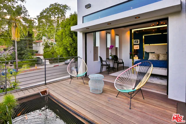 a bed room with a bed and a chandelier