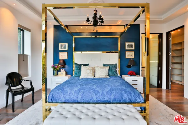a living room with a bed and furniture