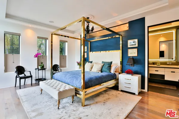 a bathroom with a granite countertop sink a vanity and mirror