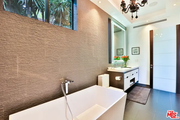 a bathroom with a bathtub and sink